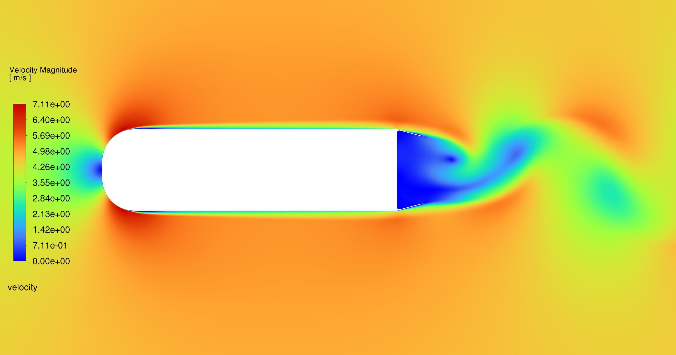 CFD velocity magnitude contour showing separated wake flow behind a D-shaped bluff body
